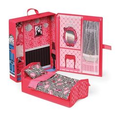 a doll house with a bed, dresser and mirror on the inside is open to show it's contents