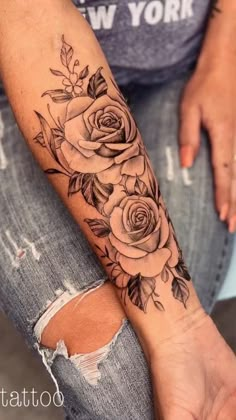 a woman's arm with roses on it and the words, i love you