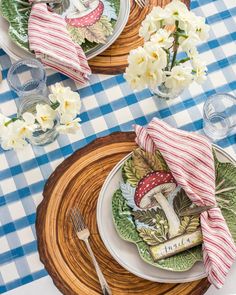 the table is set with plates and silverware