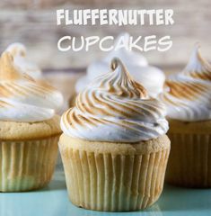 three cupcakes with white frosting on top and the words fluffernutter cupcakes above them