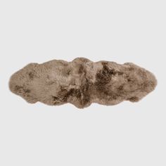 an animal fur rug on a white background