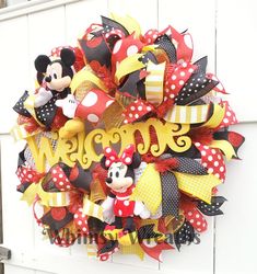 a mickey mouse wreath with the word welcome