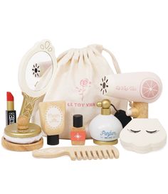 an assortment of beauty products in a drawstring bag on a white background,