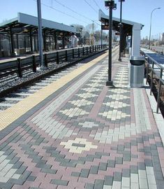 an empty train station with the tracks laid out