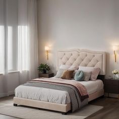 a bedroom with a bed, nightstands and two lamps on either side of the bed