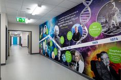 an office hallway with posters on the wall