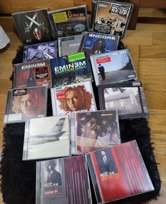 there are many cd's on the floor in front of each other, including one for men