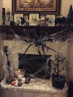 a fireplace decorated for halloween with spider web