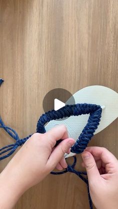 someone is making a pair of sandals out of yarn