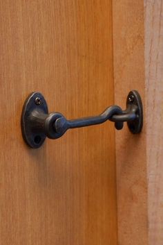 a door handle on a wooden door