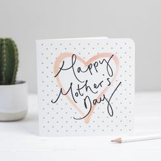 a card with the words happy mother's day written on it next to a cactus