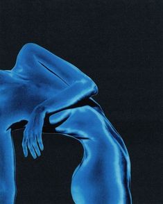 a woman's body is shown in blue light