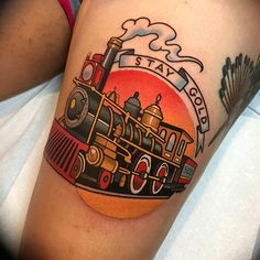 an old school style train tattoo on the leg for someone who likes to ride it