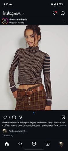 a woman in plaid pants and a turtle neck sweater is posing for the camera with her hands on her hips