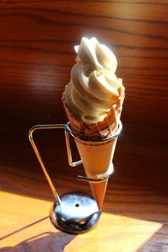 an ice cream sundae sitting on top of a wooden table