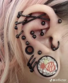 the ear is decorated with black and white beads