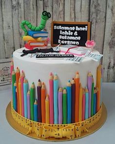 there is a cake with crayons on it