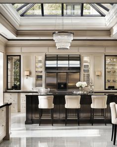 an elegant kitchen with black and white decor