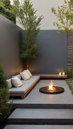 a fire pit in the middle of a patio