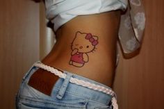 a woman with a hello kitty tattoo on her stomach