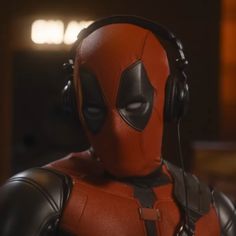 a deadpool character with headphones on