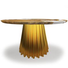 a round wooden table with gold colored metal rods on the top and bottom, against a white background