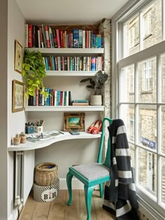 a room that has some books on the shelves and a chair in front of it