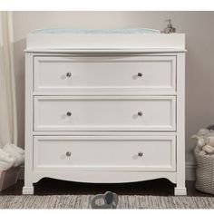 The Kalani changing table dresser is the smart storage solution for the classic collections. Three roomy drawers provide ample storage to simplify the organization while thoughtful design ensures a style fit for any nursery. The dresser is detailed with recessed front drawer panels, a gently curved apron front, and curved top sides. daVinci Color: White | daVinci Kalani Changing Table Dresser 32.25 H x 35.38 W x 21.5 D in Wood in White | 32.25" H X 35.38" W X 21.5" D | Wayfair Jenny Lind Changing Table, Changing Dresser, Metal Crib, Changing Table Topper, Llama Nursery, Baby Dresser, Changing Table Dresser, 3 Drawer Dresser, Kids Dressers