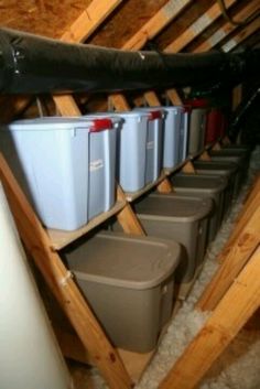 several buckets are lined up in the attic