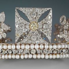 an elaborate tiara with pearls and diamonds