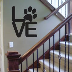 a dog's paw is shown on the wall next to stairs