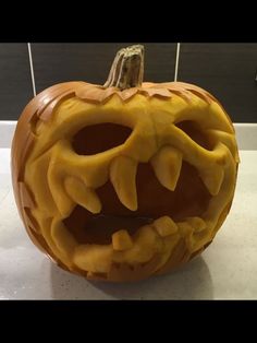 a carved pumpkin with teeth on it