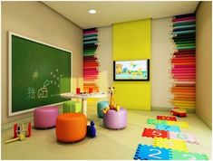 a child's playroom with colorful rugs and toys on the floor in front of a chalkboard