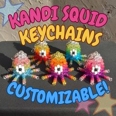 three colorful squid keychains sitting on top of a black box with the words, customizable