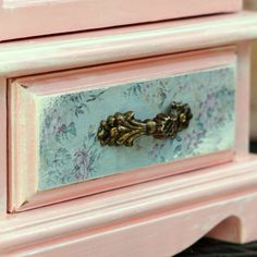 an old pink dresser with gold handles and knobs on it's drawer pulls