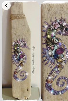 two pieces of wood are decorated with beads and jewels, one has a bottle shaped like a seahorse