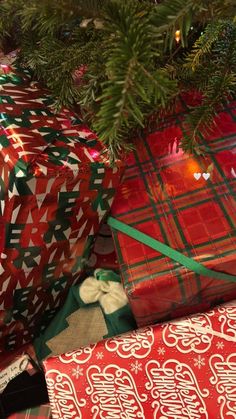 several wrapped presents under a christmas tree