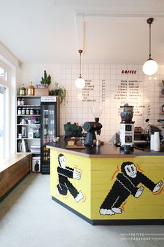 a coffee shop with a counter painted like a cartoon character