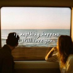 two people sitting on a train looking out the window at the ocean and saying, i'm anything happens i still love you