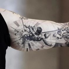 a man's arm with an artistic tattoo design on the left side of his arm