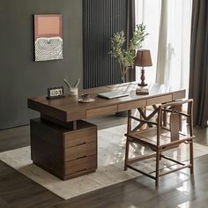 a wooden desk sitting in front of a window with a lamp on top of it