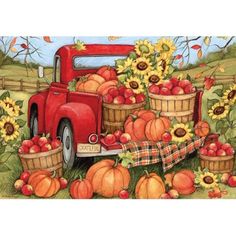 an old red truck filled with apples and sunflowers next to a basket full of pumpkins