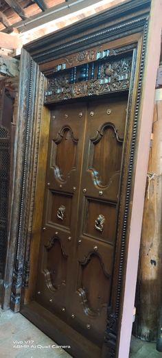 an old wooden door with ornate carvings on it