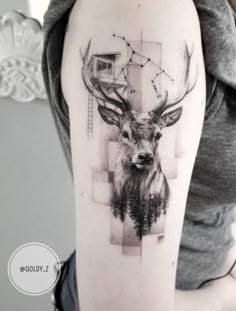 a woman with a deer tattoo on her arm