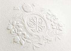 an ornate monogrammed design on a white paper