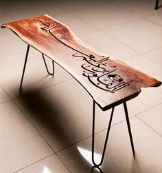 a wooden bench sitting on top of a tiled floor