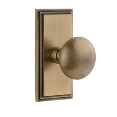 an antique brass door knob on a white background