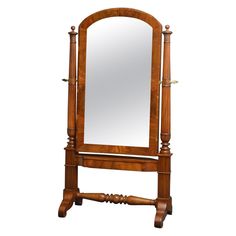 an antique wooden mirror stand on wheels