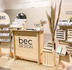 an assortment of wooden products on display in a store with the name bec design