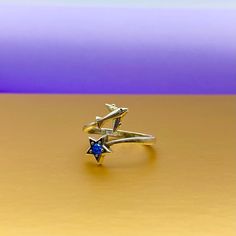 Ring Silver Airplane with blue star for aviation lovers. Material: silver 925o Weight: 2.3 gram Silver ring with plane and beautiful blue stone. Silver 925. One size. You may change size by yourself. The best gift for flight attendants. Ring of people who love travel. == With this ring we recommend == https://www.etsy.com/listing/831307662/silver-necklace-with-airplane-infinity?ref=shop_home_active_7&frs=1&cns=1 Nickel-free Sterling Silver Star Ring, Star-shaped Sterling Silver Sapphire Ring, Sterling Silver Star-shaped Sapphire Ring, Silver Star-shaped Sapphire Ring As Gift, Star-shaped Silver Sapphire Ring, Blue Sterling Silver Star-shaped Ring, Travel Ring, Flight Attendants, Gold Necklace Set